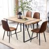 A set of 4 modern medieval style restaurant cushioned side chairs, equipped with soft cushions and black metal legs, suitable for kitchens, lounges, a